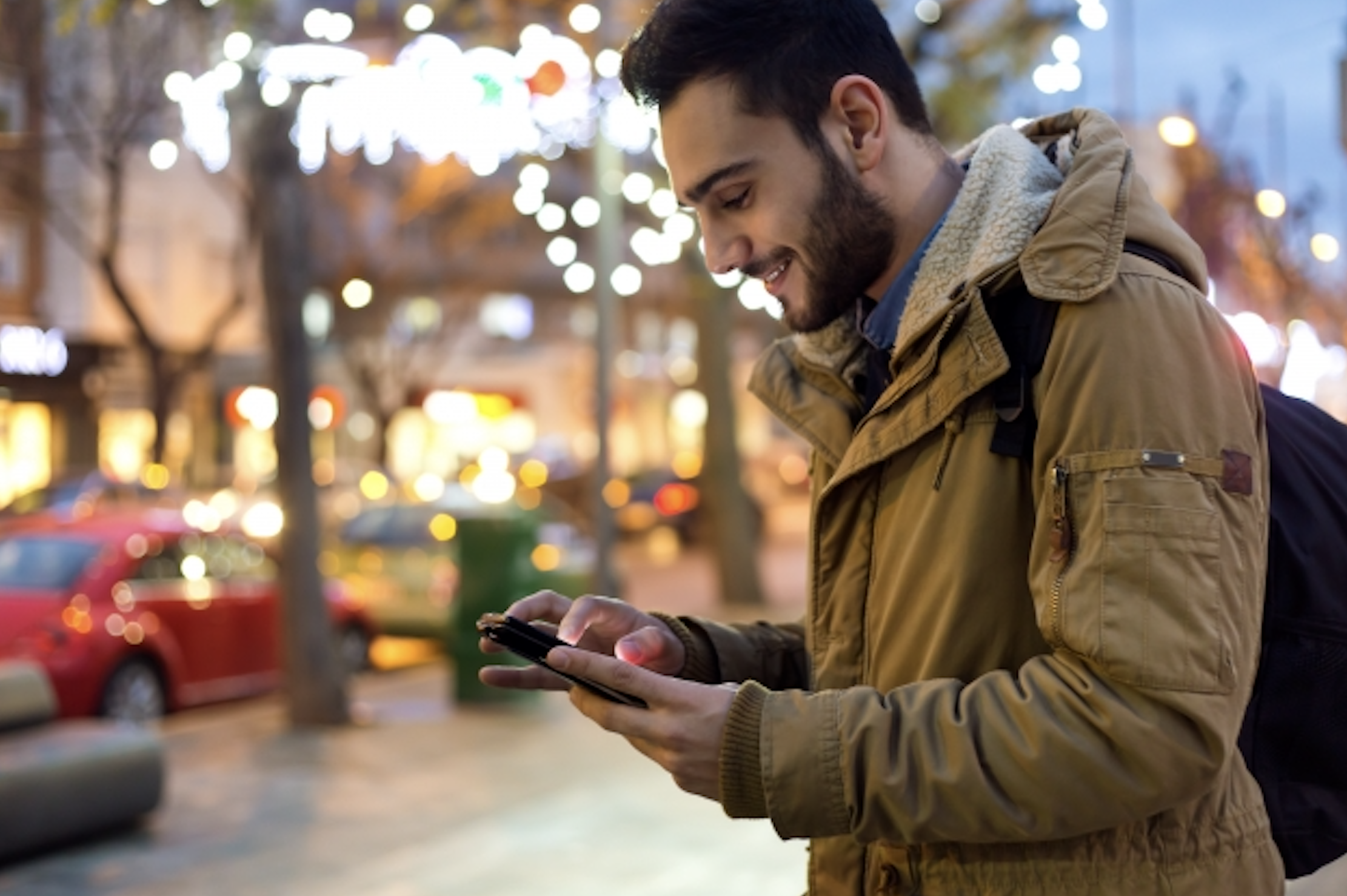 A man in a coat on his phone