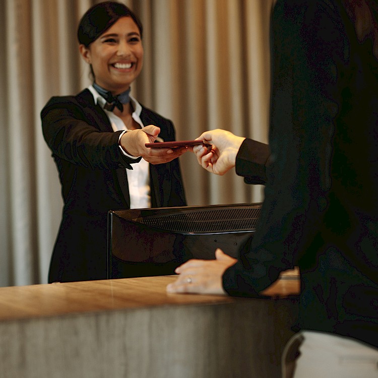 A woman receptionist smiling warmly