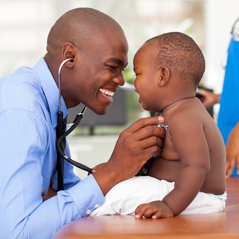 Doctor performing a check up on an infant